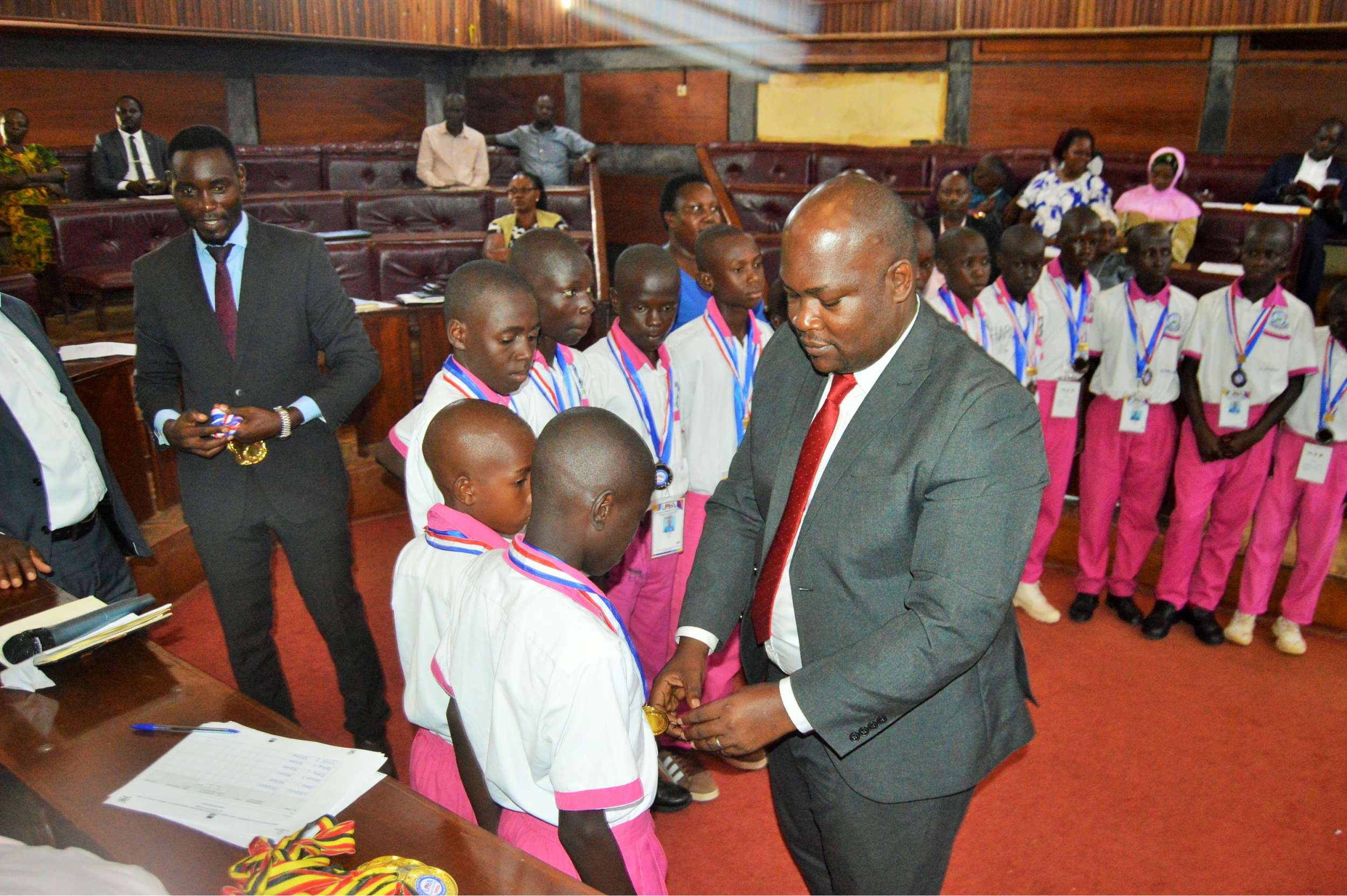 District Chairperson-Hon Kawuki Simon Peter recognizes and celebrates excellence of Mpigi Pupils with Disabilities for winning the Trophy and Gold medals at the National Paralympic Games