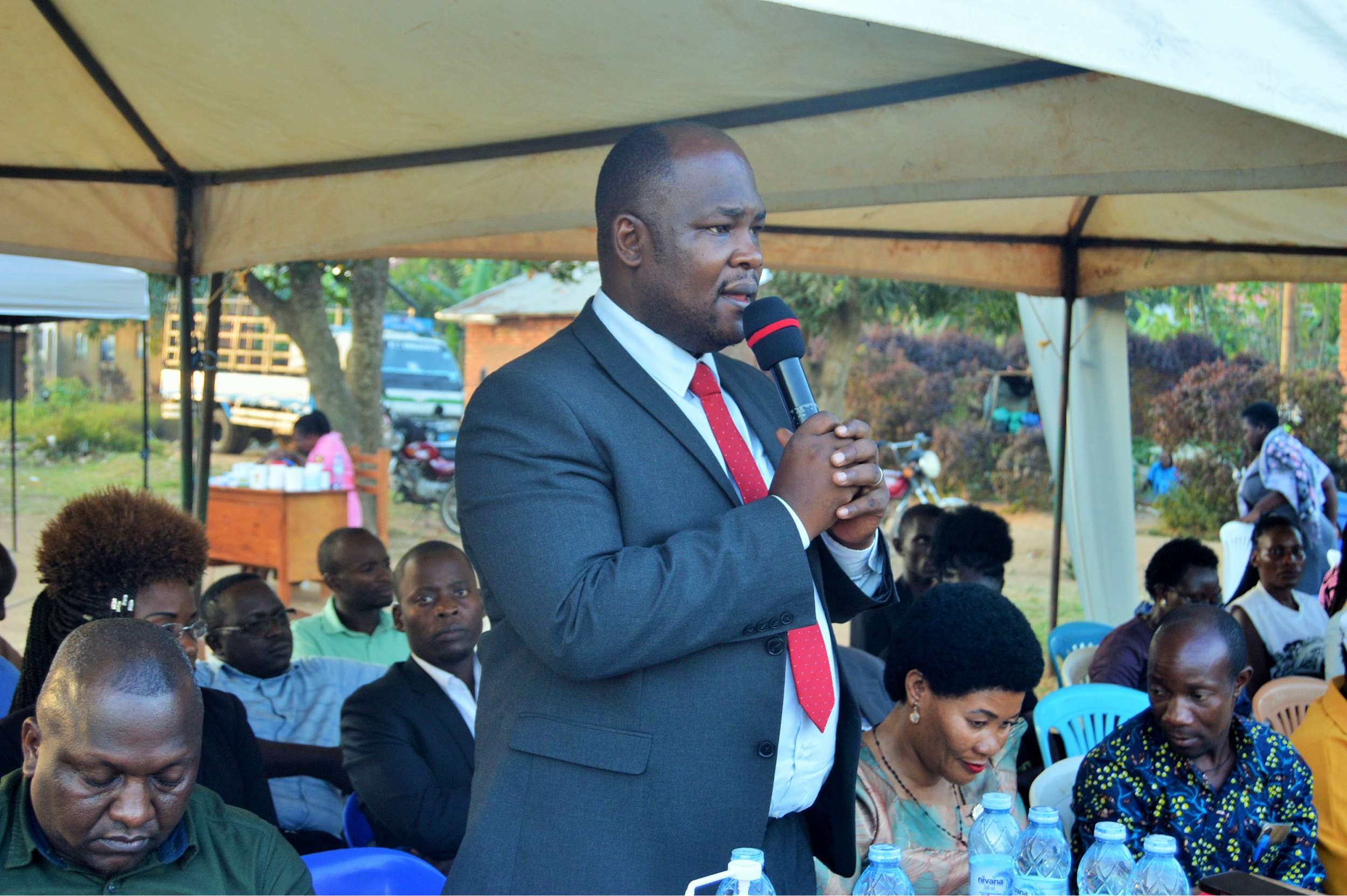 District Chairperson-Hon. Kawuki Simon Peter addressing community during Community Baraza held at Nabyewanga in Nkozi Sub-County