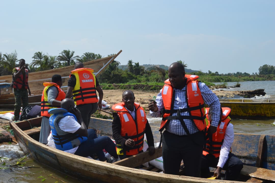 District Chairman -Hon. Kawuki Peter & Councilors together with CAO- Ms Edith Namayega boarding a boat to Buyiga island during a monitoring and supervision exercise