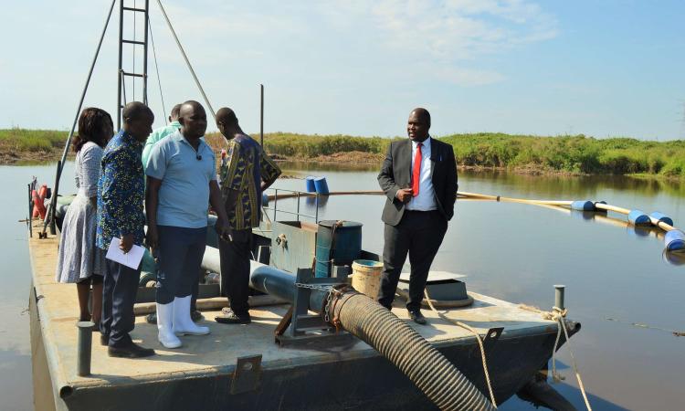 District Chairperson-Hon Kawuki Simon Peter together with the NRM Chairperson-Mr Kaweesi Sulaiman visiting sand mines in Lwera